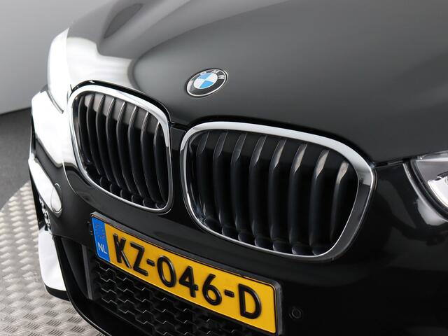 BMW X1 sDrive20i Centennial High Executive M-Sport (NL-Auto / Afn. trekhaak nieuw! / Head Up / Navi)