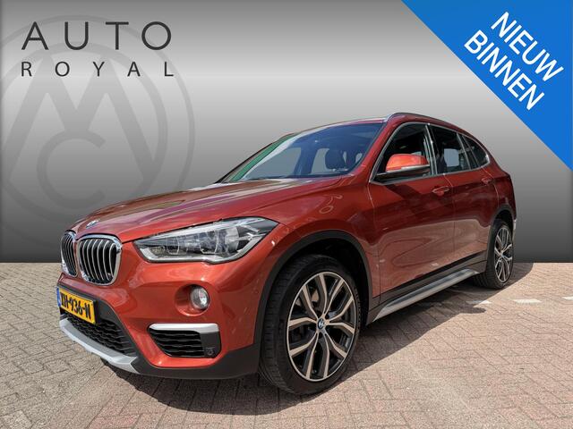 BMW X1 sDrive20i Orange Edition II AUTOMAAT| LEDER SPORT INTERIEUR| PANORAMADAK| CAMERA| NAVIGATIE| AIRCO/ECC | CRUISECONTROL| TREKHAAK| PARKEERSENSOREN