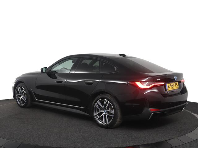 BMW i4 eDrive40 84 kWh Trekhaak Elektrisch | Camera | Parkeersensoren voor en achter | Stoelverwarming | Harman Kardon | M Hemelbekleding Anthrazit