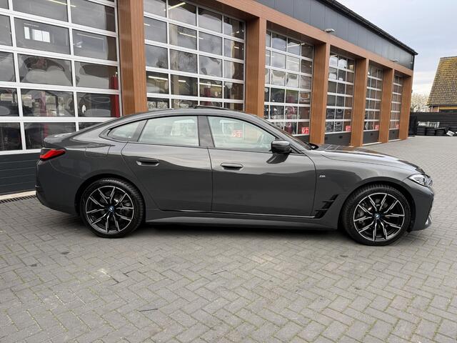 BMW i4 eDrive40 84 kWh | M-Pakket | Schuifdak | Dravitgrau metallic | NL-Auto |