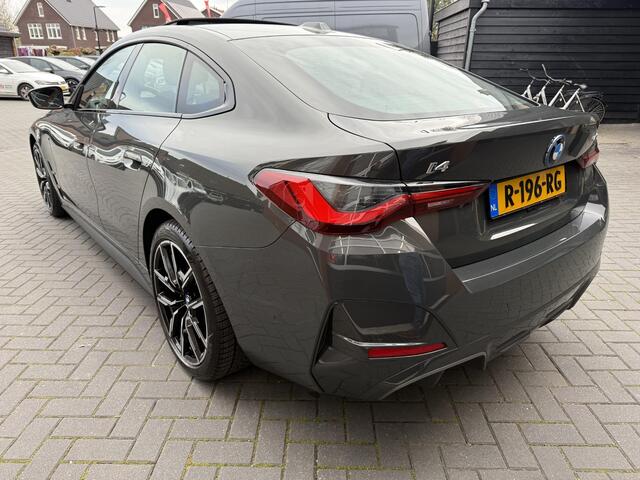 BMW i4 eDrive40 84 kWh | M-Pakket | Schuifdak | Dravitgrau metallic | NL-Auto |
