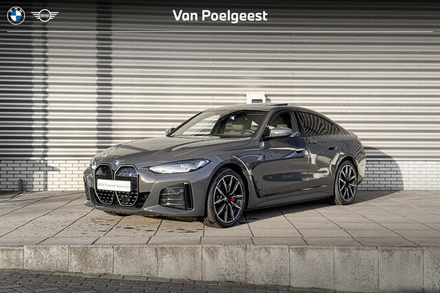 BMW i4 eDrive40 M Sportpakket Pro / High Executive / Achteruitrijcamera / Elektrisch bediend glazen schuif-/kanteldak / Elektrisch verwarmde voorstoelen