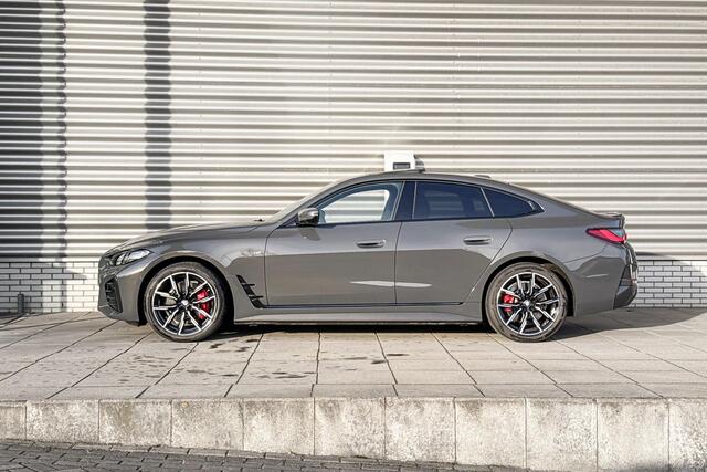 BMW i4 eDrive40 M Sportpakket Pro / High Executive / Achteruitrijcamera / Elektrisch bediend glazen schuif-/kanteldak / Elektrisch verwarmde voorstoelen