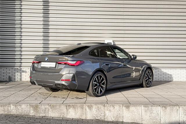 BMW i4 eDrive40 M Sportpakket Pro / High Executive / Achteruitrijcamera / Elektrisch bediend glazen schuif-/kanteldak / Elektrisch verwarmde voorstoelen