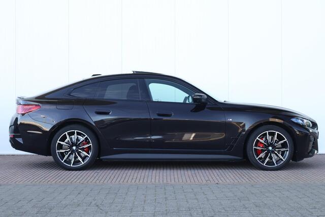 BMW i4 eDrive40 M Sport Edition 84 kWh M Sportpakket Pro/ Rubin-Metallic Individual Special Request Lakkleur/ Harman-Kardon/ Trekhaak/ Driving Assistant Professional