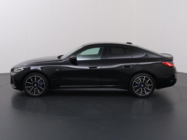 BMW i4 eDrive35 High Executive 70 kWh | M-Pakket | SOH 96% | HUD | Sportstoelen elektrisch verstelbaar + Geheugen | Camera | DAB | Apple CarPlay/Android Auto | Adaptieve Cruise Control | Ele. kofferdeksel |