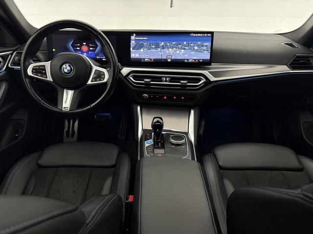 BMW i4 eDrive40 84 kWh M-Sport | M-Performance kit | Pano | 20''LMV | Widescreen | BMW-LED | Snelladen | SOH 92% | Camera | Sfeer | Virtual | Trekhaak | Carplay
