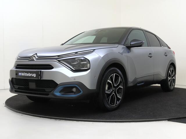 Citroen ë-C4 Shine 50 kWh I AUTOMAAT I NAVIGATIE I ACHTERUITRIJCAMERA I PARKEERSENSOREN VOOR EN ACHTER I KEYLESS ENTRY I HEAD-UP DISPLAY I VERWARMD STUURWIEL I
