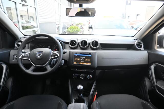 Dacia DUSTER TCe 130 Comfort | TREKHAAK | NAVI | CAMERA | AIRCO | CRUISE CONTROL | ALL-SEASONBANDEN | PDC