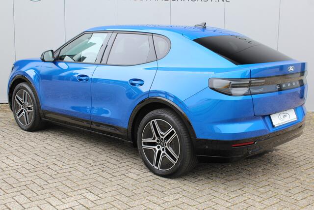 Ford CAPRI Premium Extended Range RWD 77 kWh. Fabrieksgarantie t/m 05-06-2029 ! Autm. airco, warmtepomp, side assist, adapt. cruise cntrl, camera v+a, stoel- en stuurwiel verw., lederen int., metallic lak, elektr. achterklep, navigatie, telefoonvoorb. etc