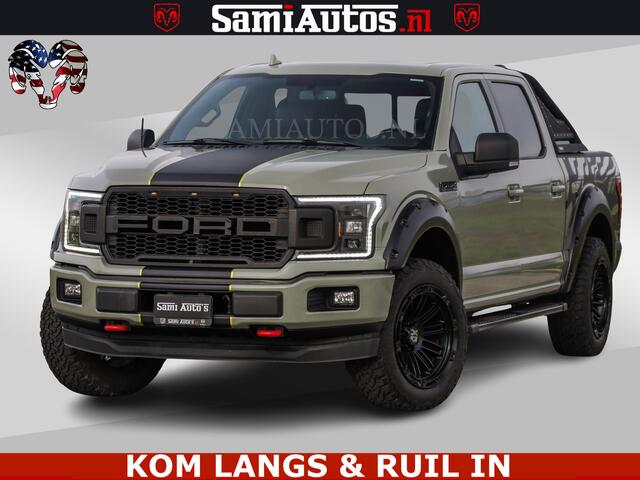 Ford F-150 5.0 V8 4X4 | MAT OLIVE GREEN | ZEER DIK | CAMERA | 3500KG | PANORAMA | LEDER | GO RHINO ROLLBAR | CRUISE CONTROL | PRINS LPG | BAKFLIP COVER | Deze pick-up is leverbaar met zowel een groot rijbewijs (C) als een klein rijbewijs (B). Laat ons weten wat jouw