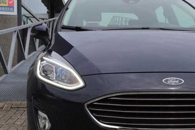 Ford FIESTA 1.0 EcoBoost Titanium Cruise control/Climate control/Lane assist/Apple carplay/Parkeersensoren/DAB+/Elektrisch inklapbare spiegels/16'' Lichtmetalen velgen.