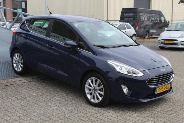 Ford FIESTA 1.0 EcoBoost Titanium Cruise control/Climate control/Lane assist/Apple carplay/Parkeersensoren/DAB+/Elektrisch inklapbare spiegels/16'' Lichtmetalen velgen.