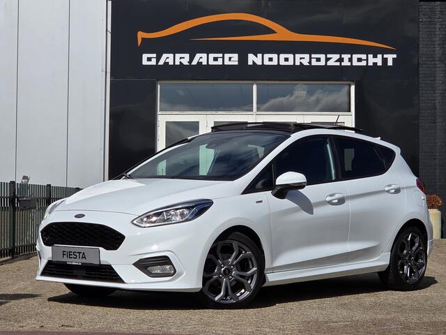 Ford FIESTA 1.0 ST-Line PANORAMADAK|NAVIGATIE|CAMERA|CRUISE CONTROL|STOEL&STUUR VERWARMING|ECC/AIRCO|PDC ACHTER|17 INCH|DEALERE ONDERHOUDEN Maandag tot Vrijdag geopend van 09.00 tot 20.00 uur en Zaterdag van 09.00 tot 18.00 uur
