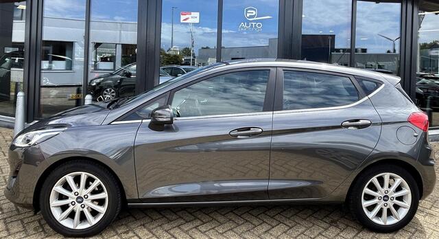 Ford FIESTA 1.0 EcoBoost Titanium 101PK | 1e Eigenaar! | Dealeronderhouden | NL AUTO | AUTOMAAT | Trekhaak | Achteruitrijcamera | B&O Audio | Navigatie | Climate Control | Adaptive Cruise Control | Voorruitverwarming | Parkeersensoren Voor en Achter |