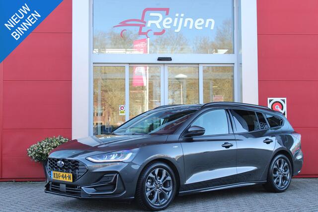 Ford FOCUS Wagon 1.0 155PK AUTOMAAT Hybrid ST LINE | ALL SEASON BANDEN | NAVIGATIE | DRAADLOZE APPLE CARPLAY/ANDROID AUTO | ADAPTIVE CRUISE CONTROL | LANE ASSIST | DODEHOEK DETECTIE | PARKEERSENSOREN VOOR + ACHTER | ACHTERUITRIJ CAMERA | LICHTMETALEN VELGEN 17" | DA