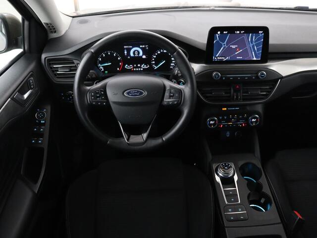 Ford FOCUS 1.0 EcoBoost Titanium | Stoelverwarming | Trekhaak | Adaptive cruise | Carplay | Keyless | Navigatie | Parkeerhulp | Stuurverwarming | Climate control | Getint glas