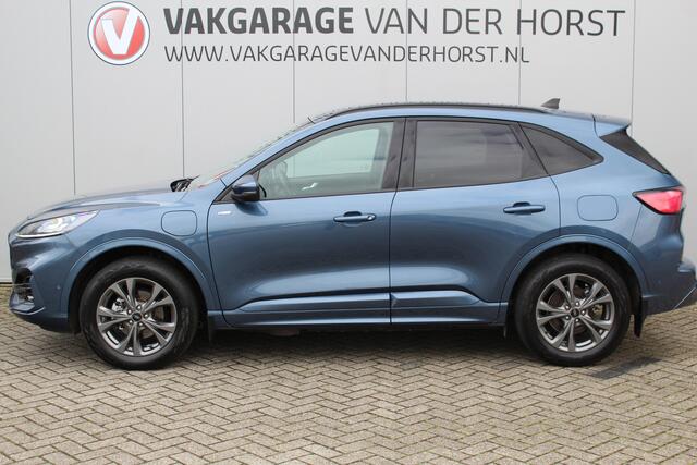 Ford KUGA 2.5-225 pk PHEV ST-Line X. Hybride rijden voor een reëel bedrag ! Slechts 31.500km ! Stoel-, stuur-, achterbank en voorraamverw., B&O soundsyst., Adaptieve Cruise Control, Climate Control dual, Camera v+a, Navigatie, Telefoonvoorb., Side- en lane assist e