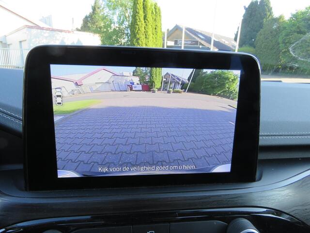 Ford KUGA 2.5 PHEV Vignale NAVI,ADAP CRUISE,PANODAK,ELEKTRISCHE TREKHAAK,LEER,WINTER PAKKET,APP CARPLAY. ARTIC WEISS METALLIC.