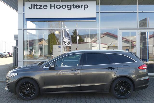 Ford MONDEO Wagon 2.0 IVCT HEV Titanium 18 INCH, ELEKT. TREKHAAK (750KG), WINTER PACK, MEMORY, CRUISE, CLIMA, NAVI, CAMERA, PDC V&A, APPLE CARPLAY/ANDROID AUTO, BLIS, KEYLESS, ELEKT. PASSAGIERSSTOEL, ELEKT. ACHTERKLEP, ADAPTIEVE KOPLAMPEN, LANE ASSIST, 57.812KM