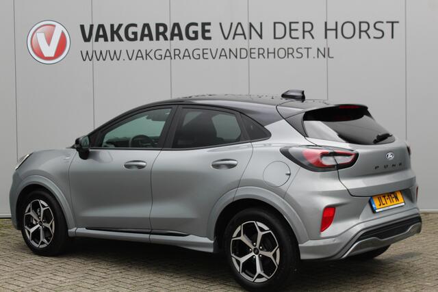 Ford PUMA 1.0-125pk EcoBoost Mild-Hybrid ST-Line, two-tone. Alwéér een prachtige hoogzitter met slechts 9.400km ! Autm. airco, camera 360gr., LM wln, side- en lane assist, adaptieve cruise cntrl, navigatie, telefoonvoorb., stoel-, stuur-- en voorraamverw. etc.