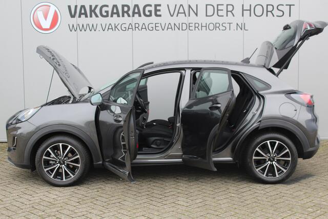 Ford PUMA 1.0-125pk EcoBoost Mild-Hybrid Titanium. Fabrieksgarantie t/m 21-05-2027 ! Slechts 14.800km ! Volautm. airco, pdc achter, all season banden, stoel-, stuur- en voorraamverw., navigatie, telefoonvoorb., elektr. achterklep, cruise cntrl, keyless entry&go etc