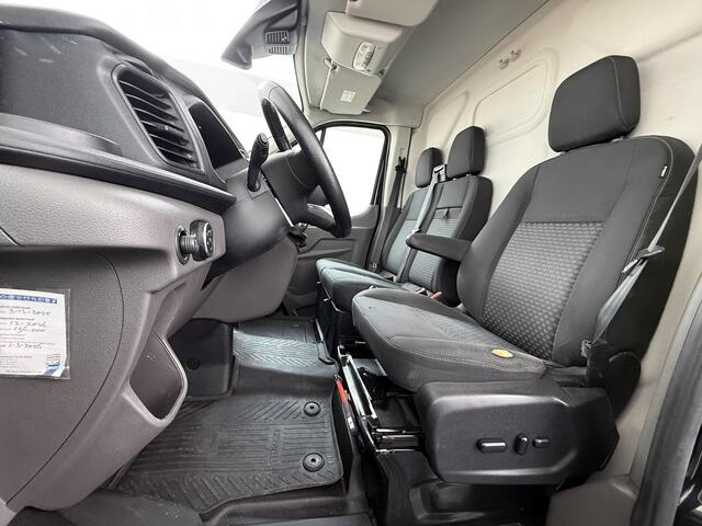 Ford TRANSIT 310 2.0 TDCI L2H2 3-Persoons Camera Airco Stoelverwarming Elek.Stoel Cruise Control Pdc Lane Assist Trend Betonplex Vloer Wandbetimmering Schuifdeur Voorruitverwarming 1e Eigenaar Origineel Nederlandse Bus