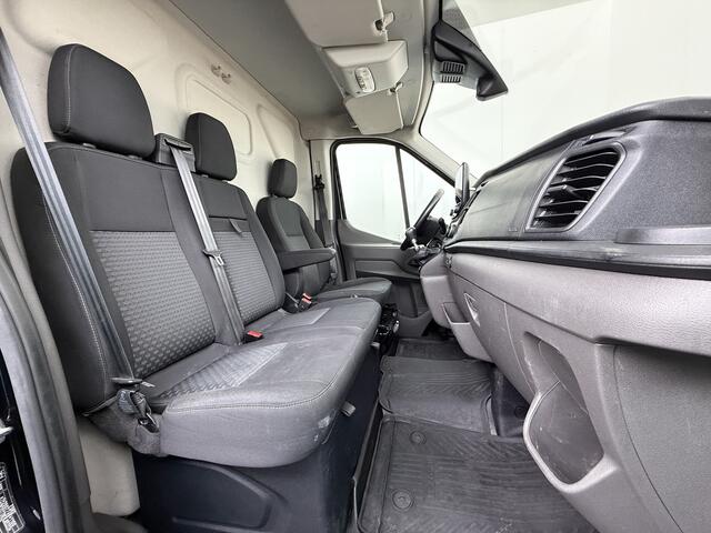Ford TRANSIT 310 2.0 TDCI L2H2 3-Persoons Camera Airco Stoelverwarming Elek.Stoel Cruise Control Pdc Lane Assist Trend Betonplex Vloer Wandbetimmering Schuifdeur Voorruitverwarming 1e Eigenaar Origineel Nederlandse Bus