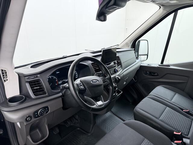 Ford TRANSIT 310 2.0TDCI 130PK L2H2 3-Persoons Navi* Camera Apple Carplay Android Auto Cruise Control Lane Assist Pdc Trend Stoelverwarming Elek.Stoel Wifi DAB Betonplex Vloer Wandbetimmering Schuifdeur 1e Eigenaar Euro 6