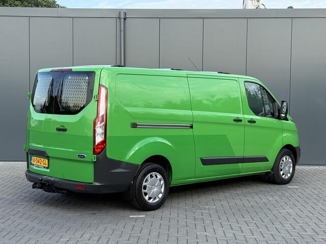 Ford TRANSIT CUSTOM 2.0 TDCI 131 PK E6 / L2H1 / 1e EIG. / 2.6 TONS TREKHAAK / AIRCO / CRUISE / NAVI / PDC