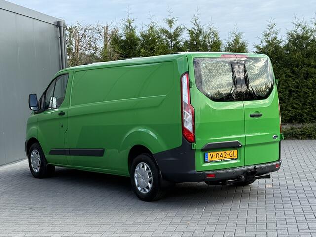 Ford TRANSIT CUSTOM 2.0 TDCI 131 PK E6 / L2H1 / 1e EIG. / 2.6 TONS TREKHAAK / AIRCO / CRUISE / NAVI / PDC