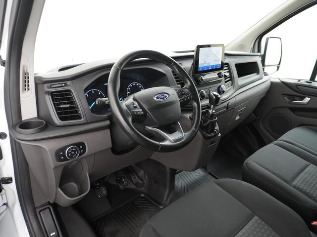 Ford TRANSIT CUSTOM 280 2.0TDCI 130PK L1H1 3-Persoons Apple Carplay Android Auto Airco Trekhaak Camera Cruise Control Pdc Voorruitverwarming Trend Regen-Lichtsensor Betonplex Vloer Wandbetimmering Schuifdeur Euro 6 385NM Koppel Zeer Compleet!