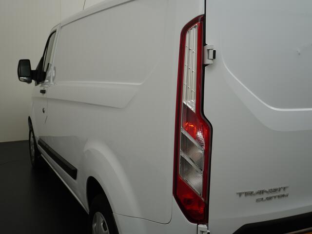 Ford TRANSIT CUSTOM 280 2.0TDCI 3-Persoons Airco Pdc-v+a Trekhaak Cruise Control Voorruitverwarming Trend Regen-Lichtsensor Betonplex Vloer Kastinrichting/Wandbetimmering Schuifdeur Euro 6 360NM Koppel 2.350Kg trekvermogen Zeer Compleet!