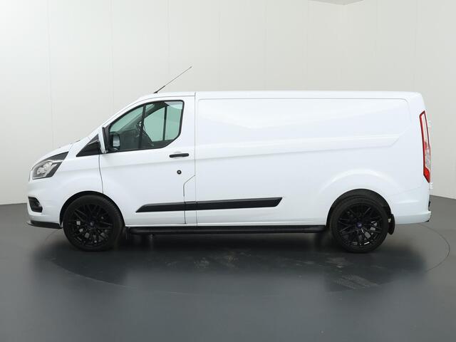 Ford TRANSIT CUSTOM 300 2.0 TDCI | Aut. | L2 H1 | Trend | Navigatie | Cruise Control | Parkeercamera | Apple Carplay | 3-zits | LM Velgen | Trekhaak
