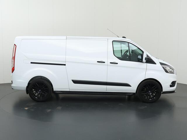 Ford TRANSIT CUSTOM 300 2.0 TDCI | Aut. | L2 H1 | Trend | Navigatie | Cruise Control | Parkeercamera | Apple Carplay | 3-zits | LM Velgen | Trekhaak