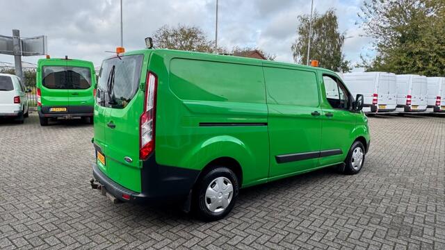 Ford TRANSIT CUSTOM 2.0 TDCI 77KW 105PK L2H1 EURO 6 AIRCO/ NAVIGATIE/ CRUISE CONTROL/ TREKHAAK/ 100% DEALERONDERHOUDEN