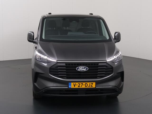 Ford TRANSIT CUSTOM 320 | 2.0 TDCI | L2 H1 | Limited | LM Velgen | 3-zits | Trekhaak | Navigatie | Apple Carplay / Android Auto | Comfort Stoelen | DAB+ | Stoelverwarming | Voorruitverwarming