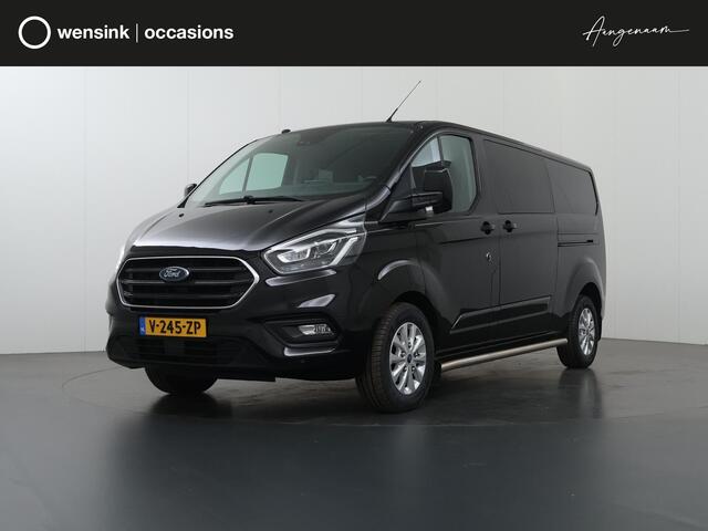 Ford TRANSIT CUSTOM 300 2.0 TDCI | L2 H1 | LIMITED | DUBBEL CABINE | AUT. | LEDEREN BEKLEDING | CAMERA | ADAPTIEVE CRUISE | STOELVERWARMING | NAVIGATIE | BI-XENON | 2X ZIJSCHUIFDEUR | AGATE BLACK METALLIC