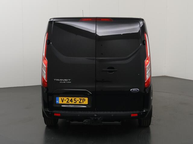 Ford TRANSIT CUSTOM 300 2.0 TDCI | L2 H1 | LIMITED | DUBBEL CABINE | AUT. | LEDEREN BEKLEDING | CAMERA | ADAPTIEVE CRUISE | STOELVERWARMING | NAVIGATIE | BI-XENON | 2X ZIJSCHUIFDEUR | AGATE BLACK METALLIC
