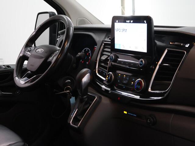 Ford TRANSIT CUSTOM 300 2.0 TDCI | L2 H1 | LIMITED | DUBBEL CABINE | AUT. | LEDEREN BEKLEDING | CAMERA | ADAPTIEVE CRUISE | STOELVERWARMING | NAVIGATIE | BI-XENON | 2X ZIJSCHUIFDEUR | AGATE BLACK METALLIC