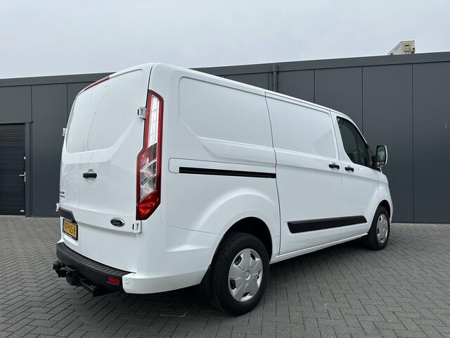 Ford TRANSIT CUSTOM 2.0 TDCI / L1H1 / 1e EIG. / 2.500 KG AHG / CAMERA / TREKHAAK / CRUISE / AIRCO / NAVI / STOELVERW.