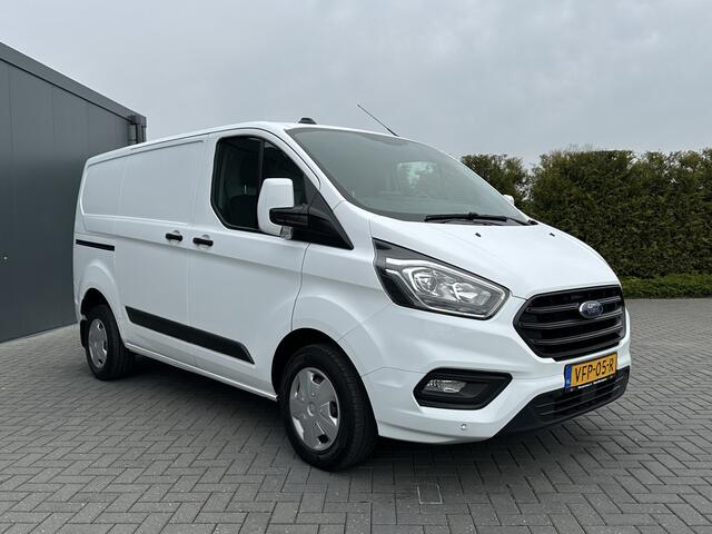 Ford TRANSIT CUSTOM 2.0 TDCI / L1H1 / 1e EIG. / 2.500 KG AHG / CAMERA / TREKHAAK / CRUISE / AIRCO / NAVI / STOELVERW.