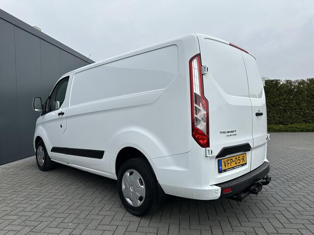 Ford TRANSIT CUSTOM 2.0 TDCI / L1H1 / 1e EIG. / 2.500 KG AHG / CAMERA / TREKHAAK / CRUISE / AIRCO / NAVI / STOELVERW.