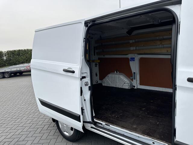 Ford TRANSIT CUSTOM 2.0 TDCI / L1H1 / 1e EIG. / 2.500 KG AHG / CAMERA / TREKHAAK / CRUISE / AIRCO / NAVI / STOELVERW.