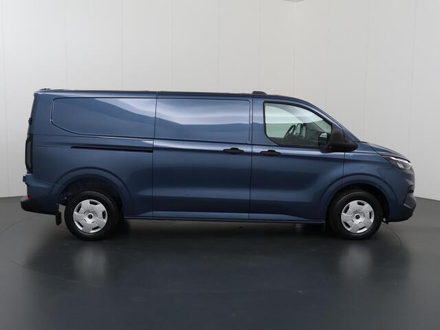 Ford TRANSIT CUSTOM 320 | 2.0 TDCI | L2 H1 | TREND | PARKEERCAMERA | APPLE CARPLAY | ANDROID AUTO | 3-ZITS | CLIMATE CONTROL | VOORRUITVERWARMING | CRUISE CONTROL | METALLIC LAK CHROME BLUE