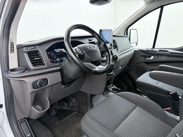 Ford TRANSIT CUSTOM 300 2.0TDCI 130PK Dubbele Cabine L2H1 Trekhaak Navi Camera Airco Cruise Control Pdc Trend DC Schuifdeur Betonplex Vloer Wandbetimmering Bott Inbouwkast Lane Assist 2.800KG Trekgewicht 1e Eigenaar
