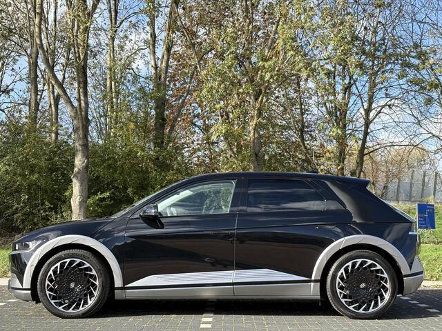 Hyundai IONIQ 5 Lounge AWD 77.4 kWh | Panoramadak | Lederen bekleding & memory functie | Warmtepomp & V2L | Geïntegreerde navigatie | Apple Carplay & Android Auto | Adaptieve Cruisecontrol | Camera | Warmtepomp | Stoel & stuur verwarming | Premium audio BOSE |