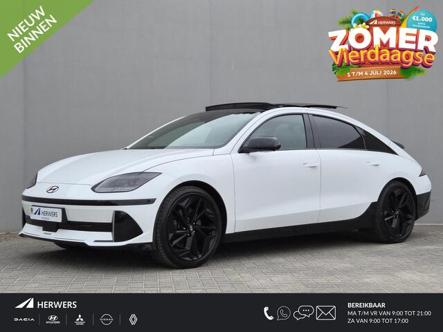 Hyundai IONIQ 6 First Edition AWD 77.4 kWh / SOH 100% / Dealer onderhouden / Fabrieksgarantie tot 02-2028 / CCS snelladen / warmtepomp / Stuur- Stoel & Achterbank verwarming / Glazen schuif- en kanteldak / WLTP bereik 519 km bereik stad 658 km / Head Up Display / Rondo