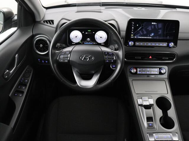 Hyundai Kona EV Fashion 64 kWh | SOH 100% | 3 Fase | Head-Up | Warmtepomp | Adaptive cruise | Camera | Carplay | Keyless | Full LED | Navigatie | Climate control