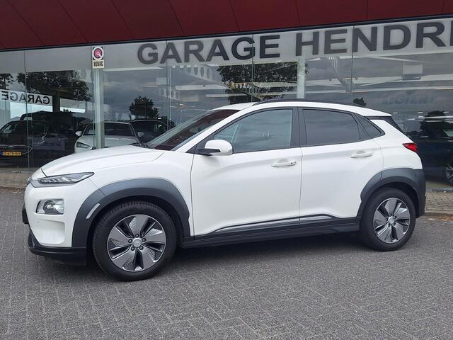 Hyundai Kona EV Premium 64 kWh | SOH: nnb | Warmtepomp | Lage km-stand | Leder | HUD | Blindspot | Full LED |